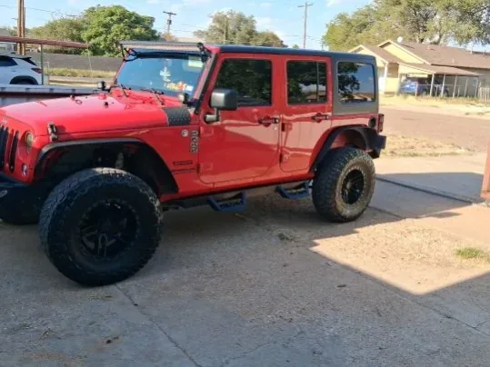 Red Jeep Wrangler Unlimited detailed in Slaton, TX