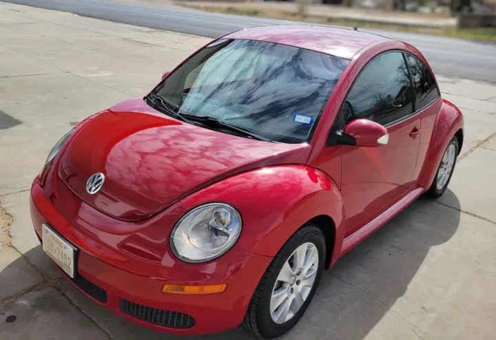 Red Volkswagen Beetle after a full detail in Slaton, TX